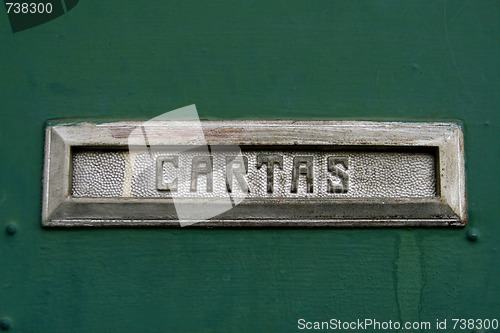 Image of Mailbox slot for letters, a word "Cartas" in Spanish on it