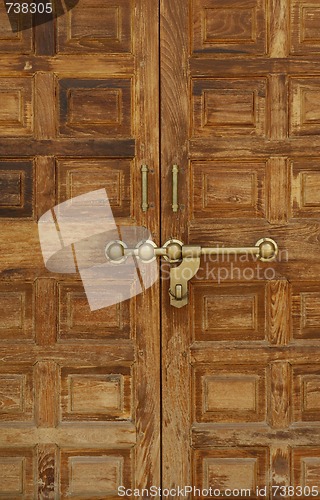 Image of Old wooden door with a massive brass lock, Indian handicraft