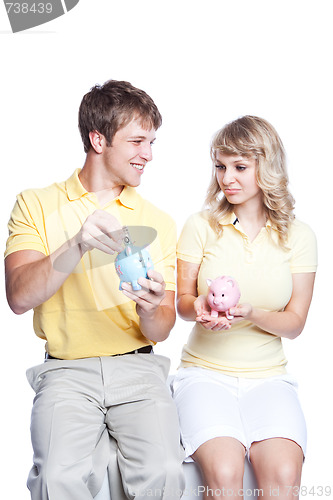 Image of Young couple saving money