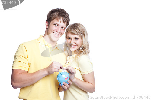 Image of Young couple saving money