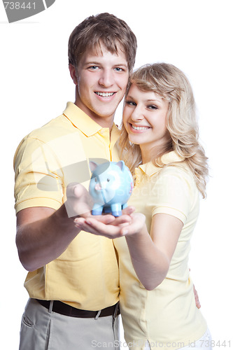 Image of Young couple saving money