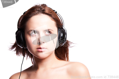 Image of Beautiful woman listening music