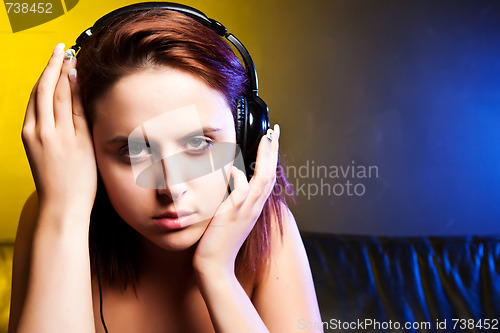 Image of Beautiful woman listening to music