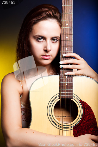 Image of Beautiful woman with guitar