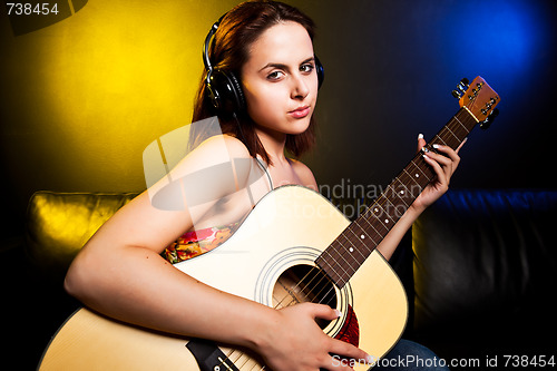 Image of Beautiful woman with guitar