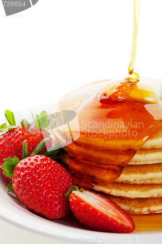 Image of Syrup Pouring on Pancakes