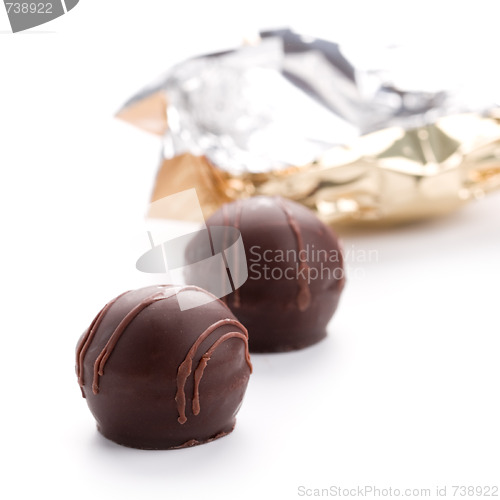 Image of two foil opened sweets