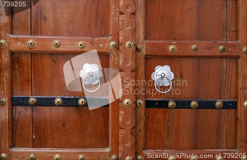 Image of Beautiful wooden door with silver handles. Pushkar, India