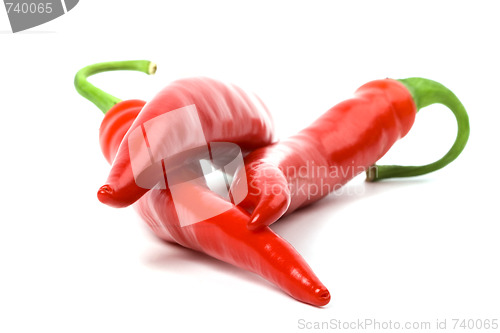 Image of three red chilly peppers