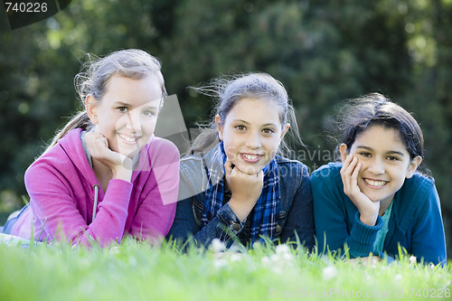 Image of Group Of Tween Girls Lying On Grass