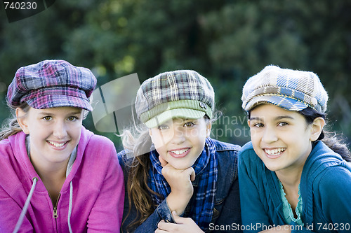 Image of Group Of Tween Girls Lying On Grass