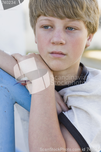 Image of Boy Leaning on Railing