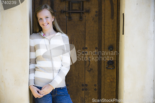 Image of Tween Girl Standing In Doorway
