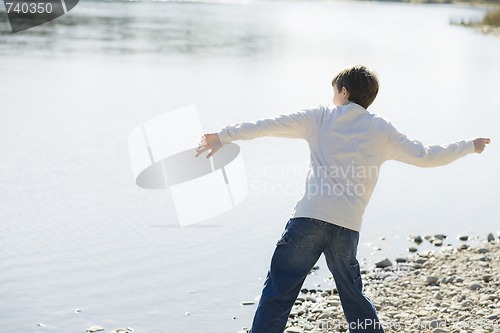 Image of Boy Throwing Stones