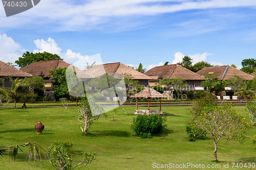 Image of Hut and villa over field