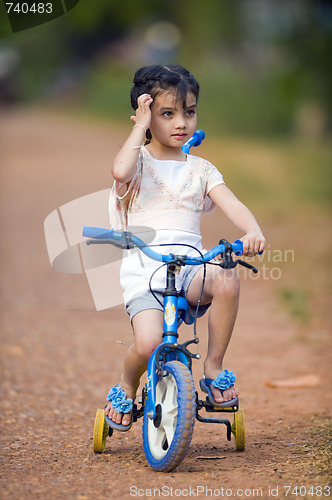 Image of pretty thai-indian girl on her bike