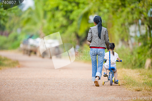 Image of mother and daughter on the road