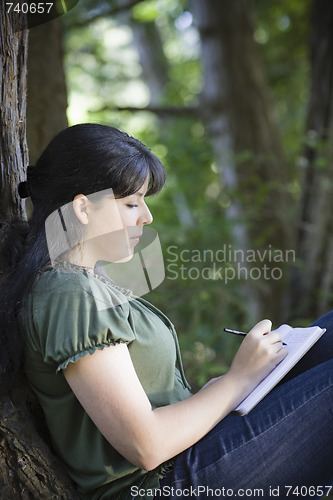 Image of Young Woman Writing in Journal