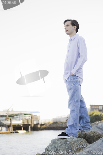 Image of Teenage Boy Looking at Ocean