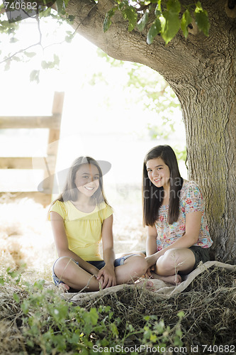 Image of Two Girls Under a Tree