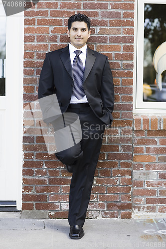 Image of Smiling Man in Suit and Tie