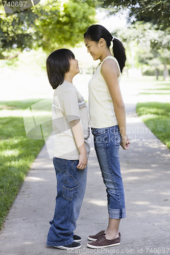 Image of Asian Brother and Sister in Park