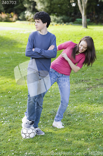 Image of Teen Boy and Girl with Soccer ball