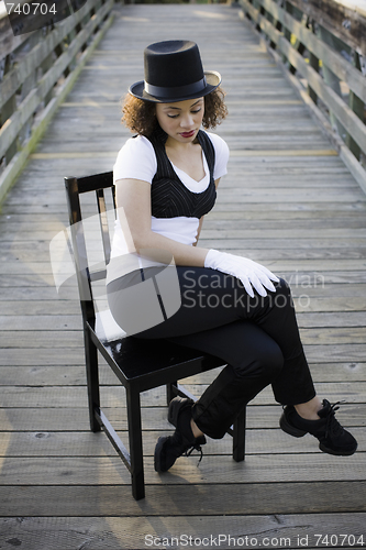 Image of Jazz Dancer Sitting on Chair