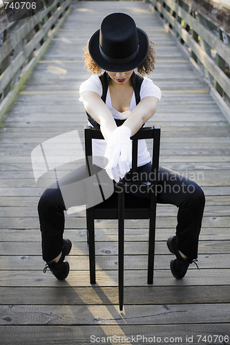 Image of Jazz dancer Sitting on Chair