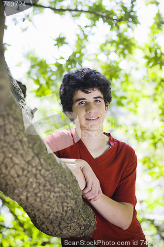 Image of Teenage Boy Standing in Woods