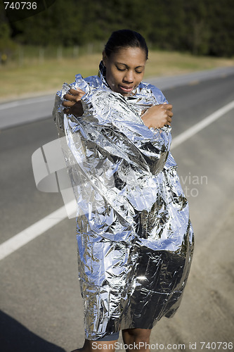 Image of Runner Wrapped in Space Blanket  