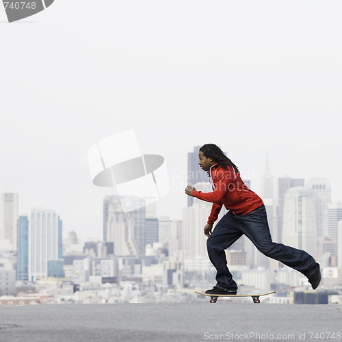 Image of Teenage Boy on Skateboard