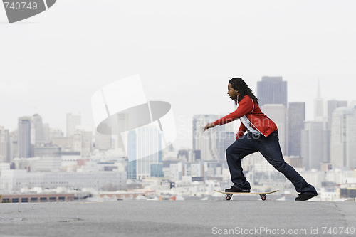 Image of Teen Boy on Skateboard