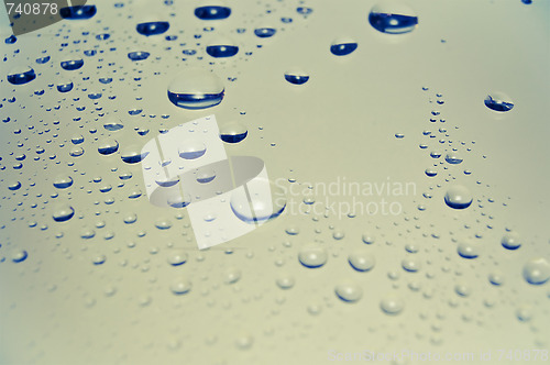 Image of Colored rain drops on the glass 