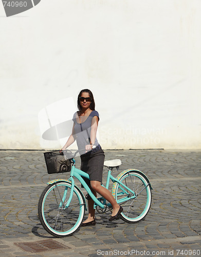 Image of Woman With A Bicycle In A City