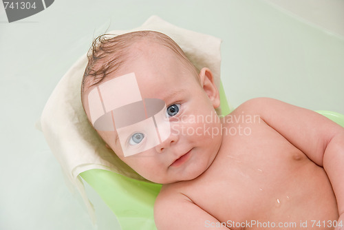 Image of baby boy having bath