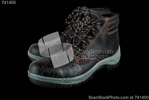 Image of moist modern working boots 