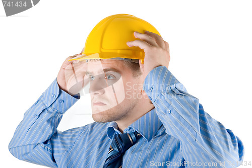 Image of business man at yellow helmet