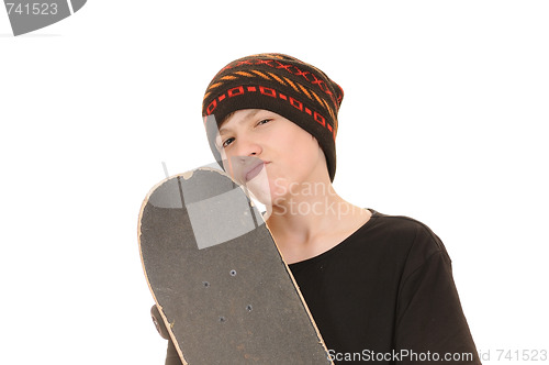 Image of The teenager with a skateboard 