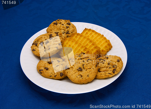Image of cookies on a Plate on a blue background