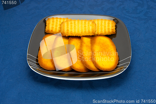 Image of cookies on a Plate on a blue background