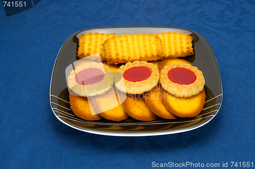 Image of cookies on a Plate on a blue background