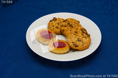 Image of cookies on a Plate on a blue background