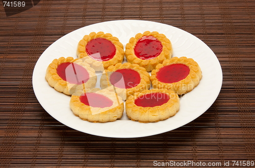 Image of plate of cookies on dark brown background