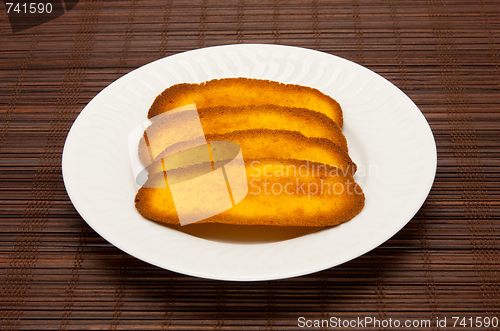 Image of plate of cookies on dark brown background