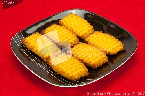 Image of plate of cookies on red background