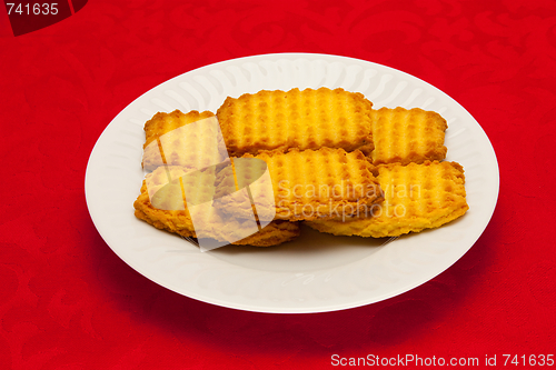 Image of plate of cookies on red background