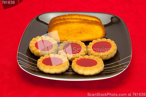Image of plate of cookies on red background