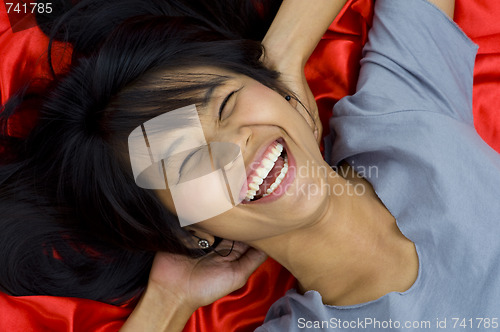 Image of beautiful, young asian laughing