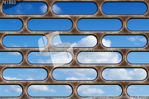 Image of blue sky through the bars